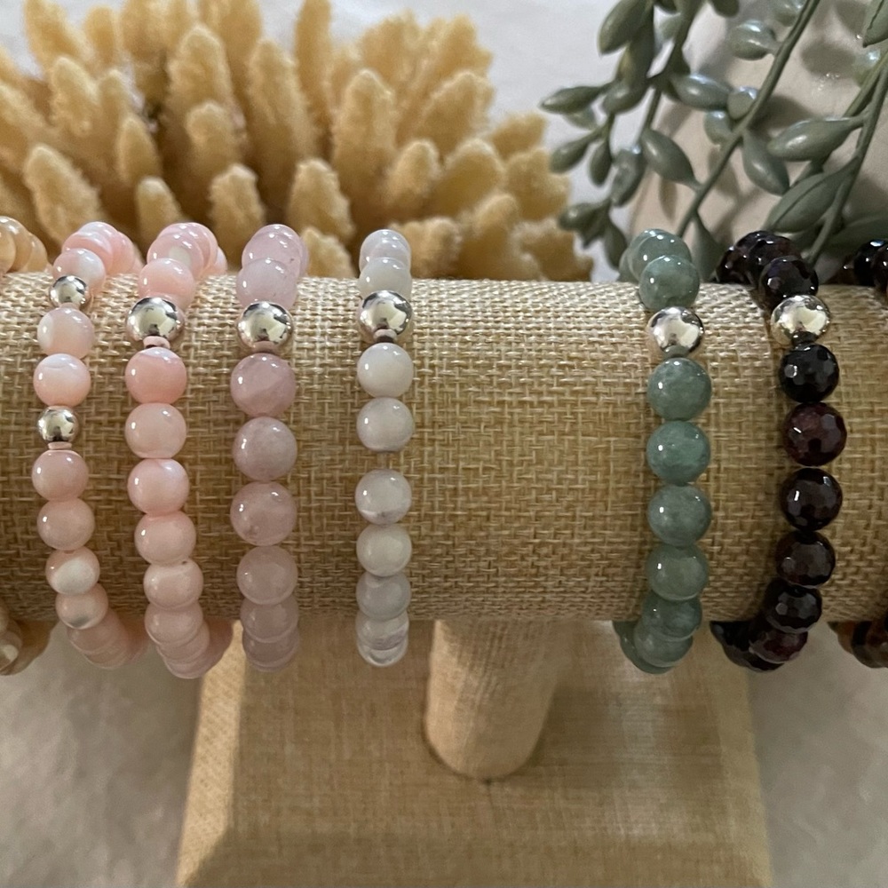 Handmade crystal stretchy bracelets w/ 925 silver. Can customize size and stone.